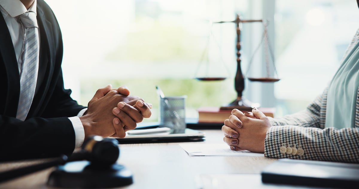Solicitors meeting with a client to discuss a personal injury claim